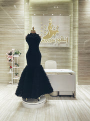 Custom-made party dress designed to flatter your figure.